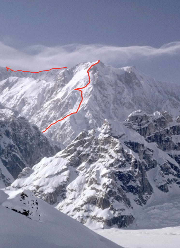Snowy mountain and ridge with a red line denoting the route the climbers took 